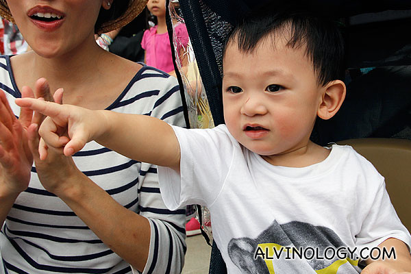 Asher excitedly pointing at the parade