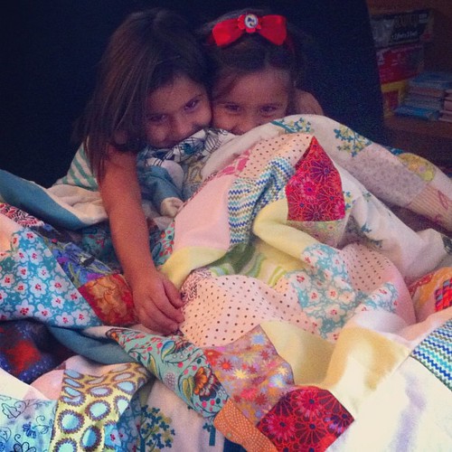Cuddling in their new quilts!