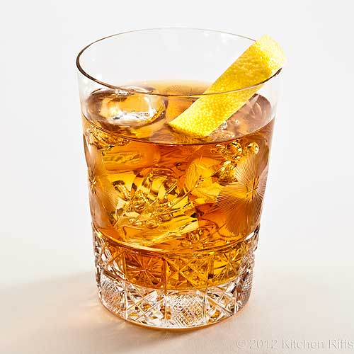 OldFashioned Cocktail in Crystal Rocks Glass with Lemon Twist Garnish 