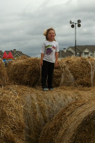 Catie on the hay bales at the farm
