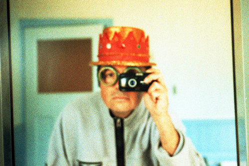 reflected self portrait with Olympus mju II camera and compound hat by pho-Tony
