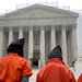 Close Guantánamo: Hooded protestors outside the Supreme Court