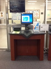 Self-check machines are next to the lower level lobby doors.