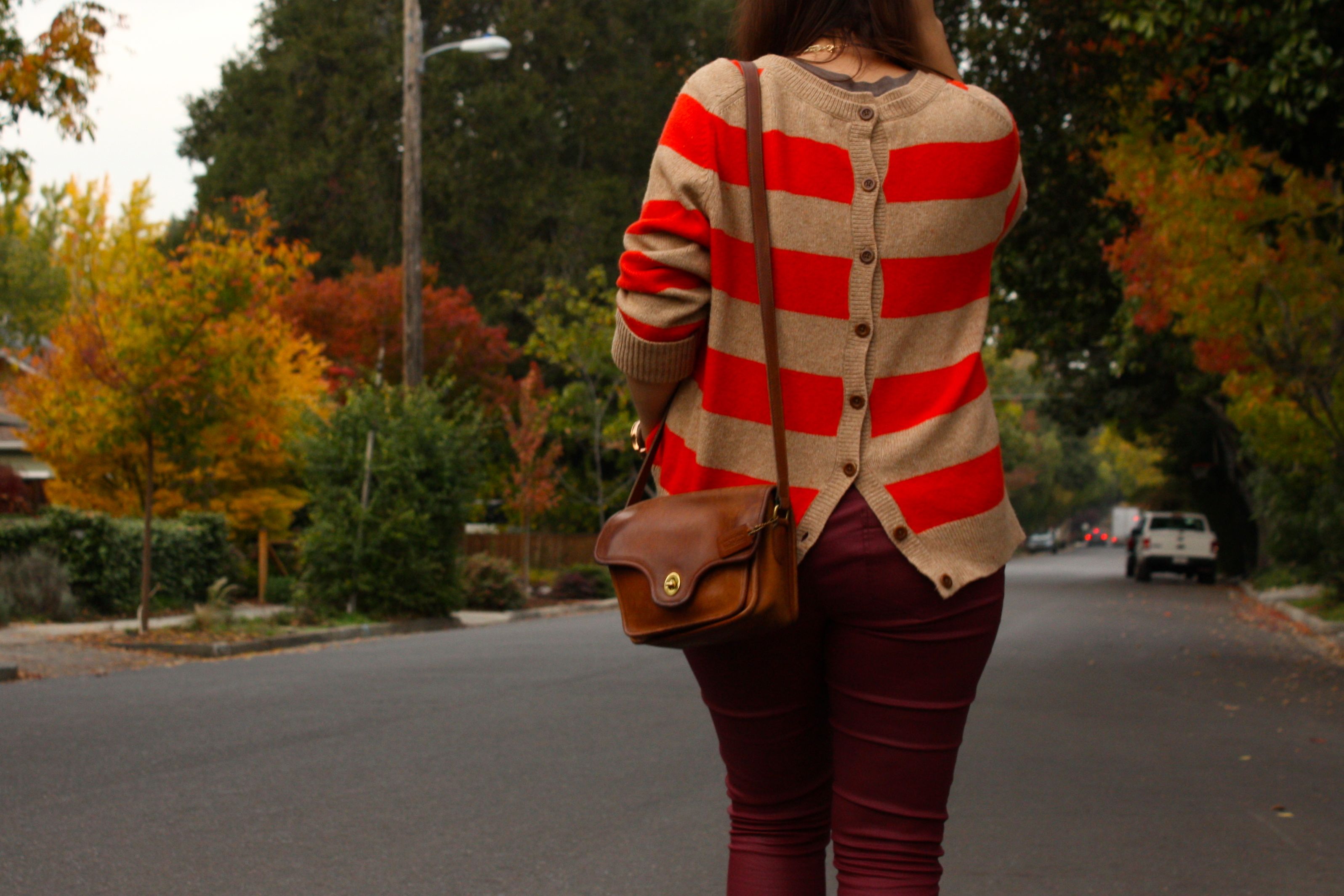 burgundy waxed jeans with orange striped lands end sweater and brown coach bag plus glitter booties01
