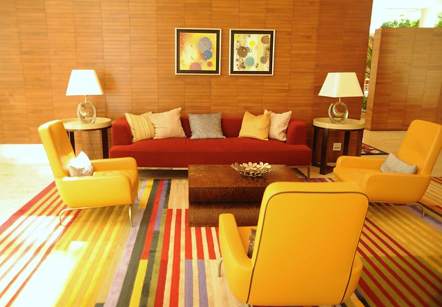 Lounge room, sofas, pillows, armchairs, end tables, lamps, art ...