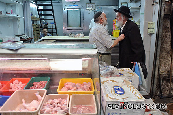 An elderly ultra-orthodox man chatting with his friend