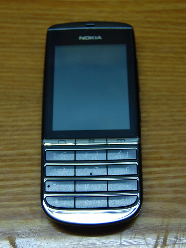 3rd hand mobile   Nokia Asha 300 fullbox mới mua 2310 tặng kèm bao da