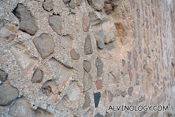 The motif was created with small stones stuck into the wall
