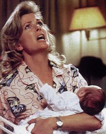 A pajamad Murphy Brown holds her baby and appears to be letting out a cry of anguish to the heavens.