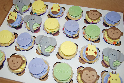 purple yellow and green jungle animal baby shower cupcakes