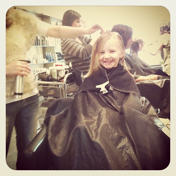 First hair cut at the salon. Someone's really excited!!