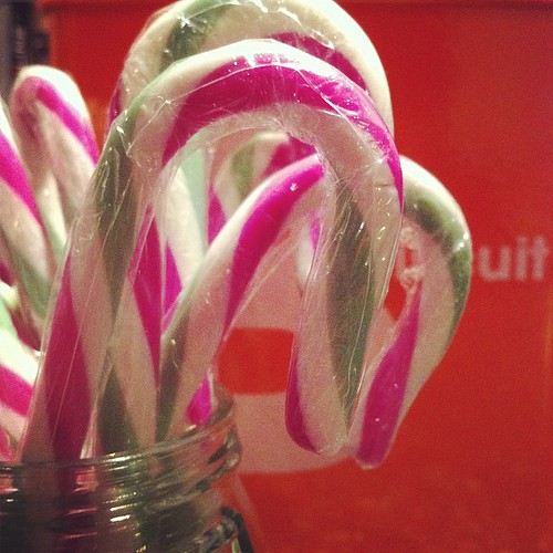 It's beginning to look a lot like #Christmas with pink and green striped #candycanes and a tin of biscuits.