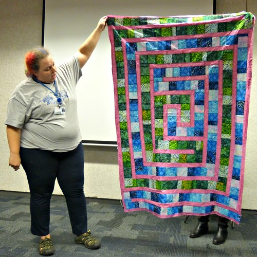 Kenzie with a quilt for her mom