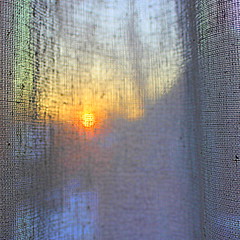 Watching The Sinking Sun Through The Curtains