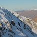 Solo ice climbers summiting Brown Cove Crags, Helvellyn