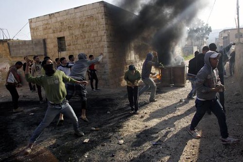Palestininans clash with Israeli security forces on January 1, 2013. The Israelis had detained a Palestinian sparking the unrest. by Pan-African News Wire File Photos