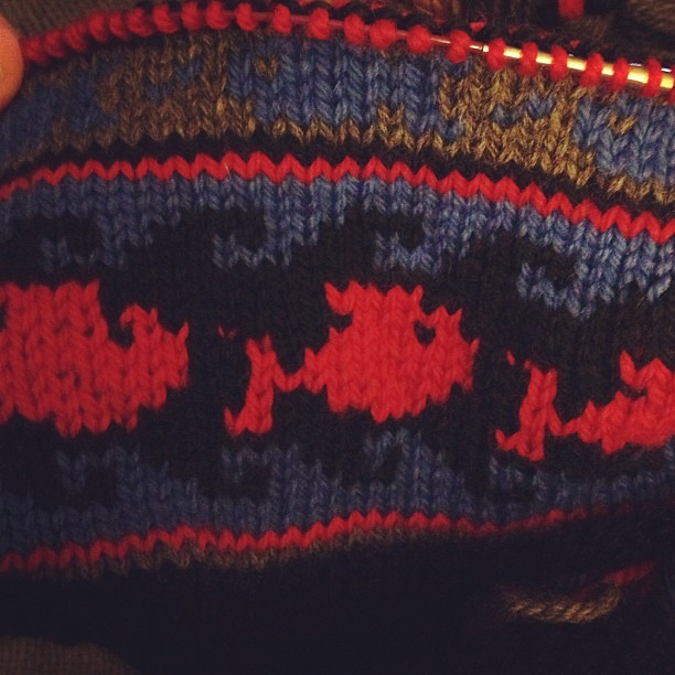 Red fish blue fish!  But the blue fish don't really show up well against the gray. Debating ripping back... Thoughts? #knit #knitting #wool #hat #handknit #fairisle #colorwork