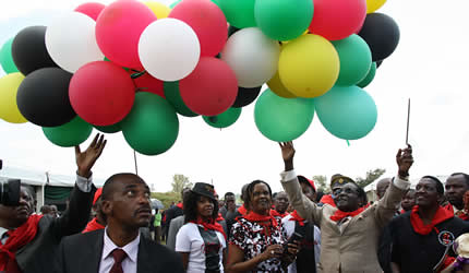 Zimbabwe President Robert Mugabe with First Lady Amai Grace at a February 21 celebration. The ZANU-PF Party is preparing for two national elections during 2013. by Pan-African News Wire File Photos