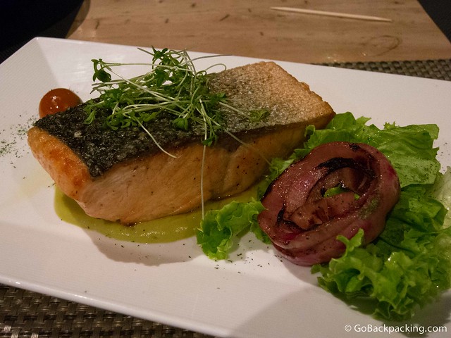Giant salmon filet with microgreens and salad