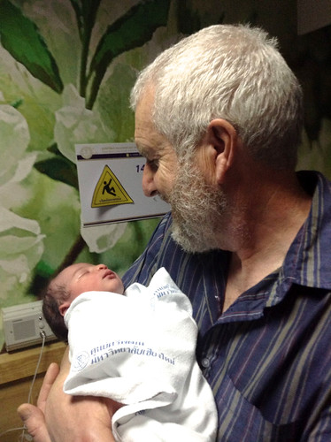Isaac with his grandpa, only a few hours old