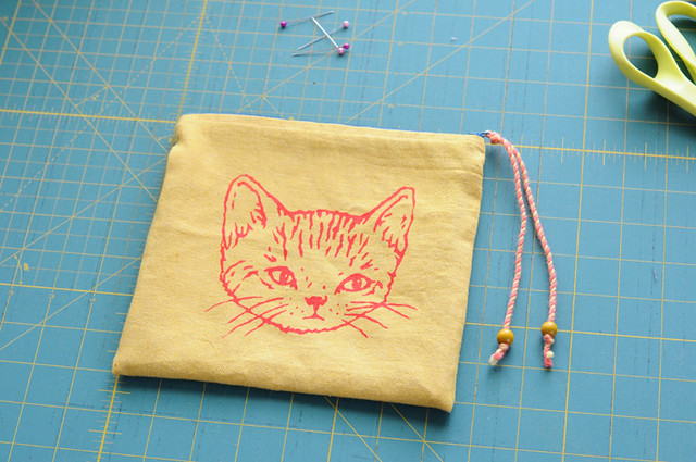 yellow zippered kitty pouch