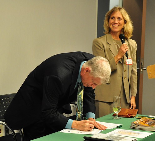 U.S. Forest Service Chief Tom Tidwell signs the forest restoration strategy as Sally Claggett, Forest Service Chesapeake Liaison, looks on. (Forest Service photo by Bob Lueckel)