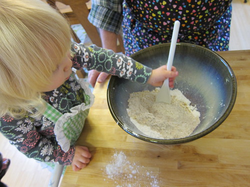 Momo mixing the dry ingredients