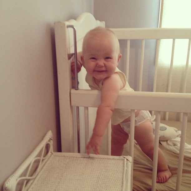 Good morning! This was how we were greeted this morning. :) (Think it's time to pull the side of the cot all the way up.) #cheekybaby