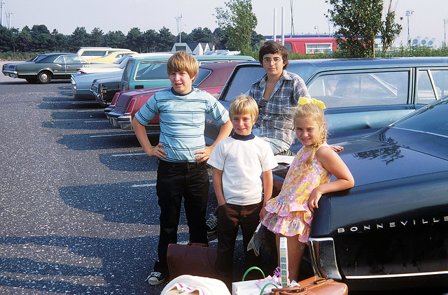 A somewhat nerdy 14 year old me on top of dad’s 1965 Pontiac with our L.A. cousins who just arrived to spend the whole summer with us in Milford, Connecticut. JFK airport. Queens New York. July 1973.