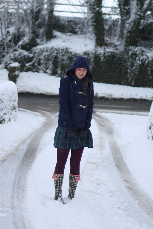 Snow - duffle coat, tartan skirt, wellies