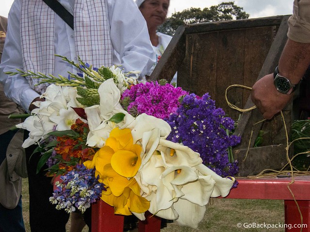 The silleteros demonstrate how they put together the silletas, or flower arrangements