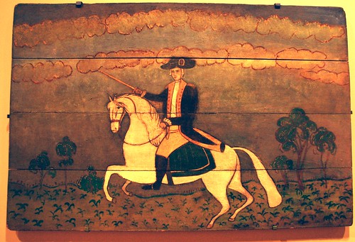 General George Washington riding a white horse, holding a sword, painted wood board, De Young Museum, San Francisco, California, USA by Wonderlane