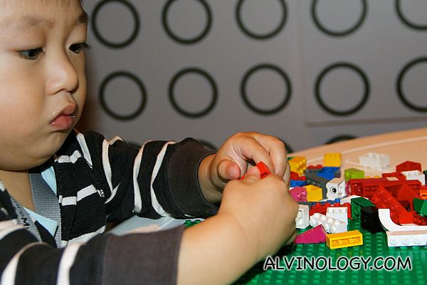 Asher playing with LEGO bricks 