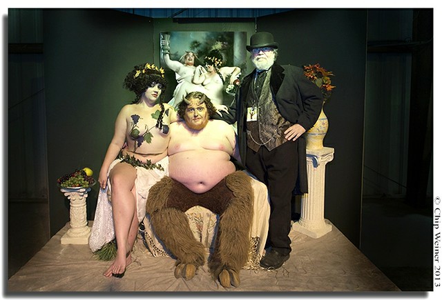 Artist Jinques-right- poses with Santana and Greg Larro his models for the portrait behind them