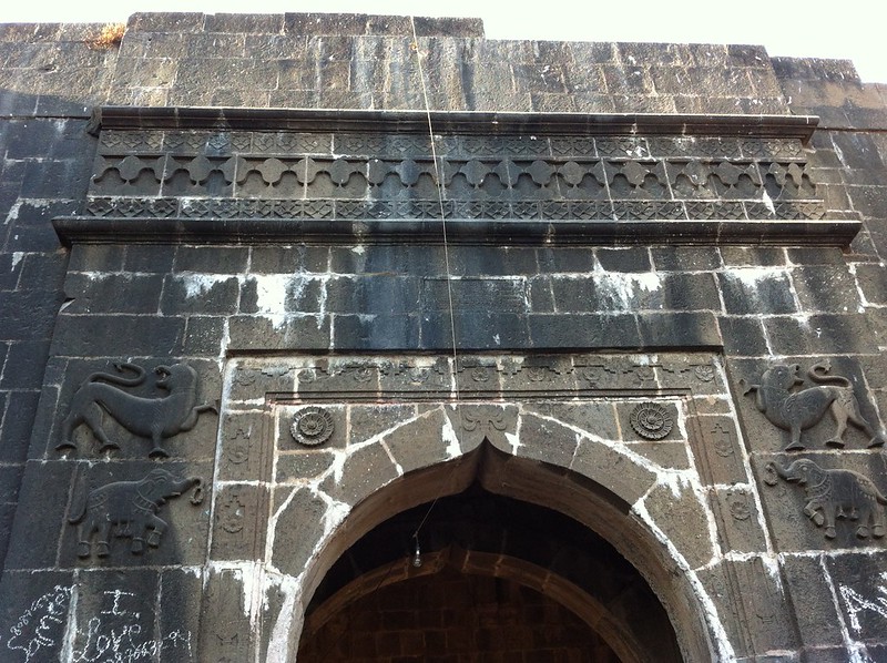Carved insignia at the entrance to Arnala fort