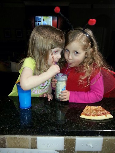 Bria and Chey sharing a cup of milk