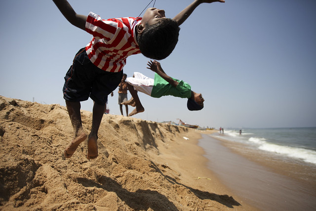 Kids jumping backside on Chennai beach