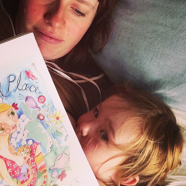 Enjoying a snuggle and one of our favorite books #thewonderfulplace #toddlerbreastfeeding @spiralgarden