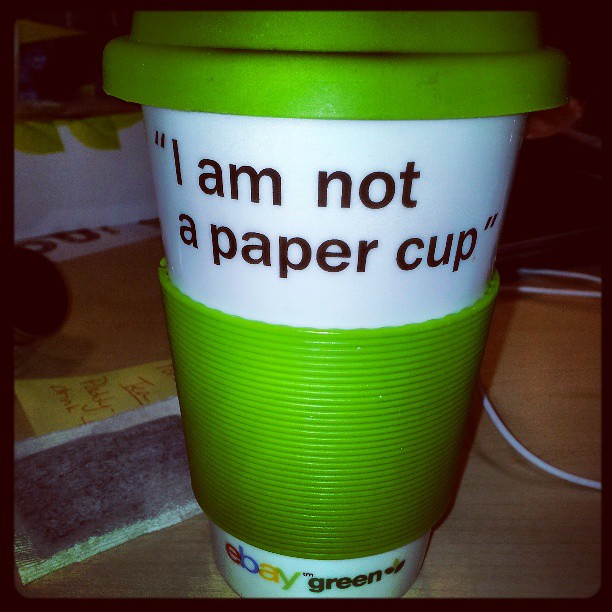 Hooray! The recycleable coffee mug has joined the battle and brought his own slogan!! I am NOT a paper cup!! #standoff #cookiewars #officehumor #office #humor #fridayfun #friday #fun #greenteam #laugh #allinadayswork #whilethecatisawaythemicewillplay