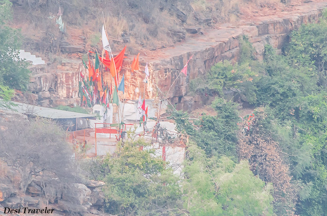 colorful flags visible on top of ranganath swamy temple Ethipothala falls