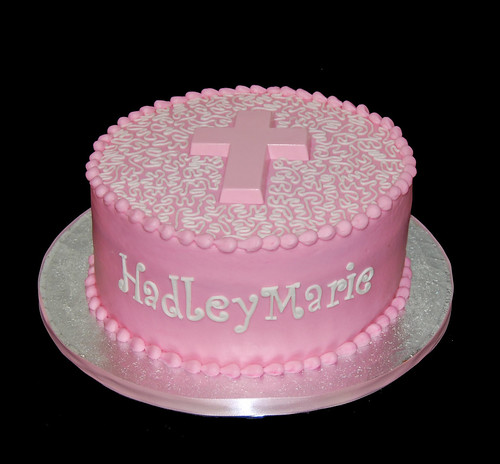 pink and white baptism cake
