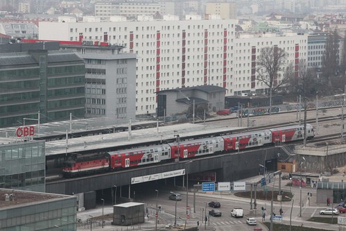 Double decked CityShuttle 'Wiesel' train operated by ÖBB departs the station with the loco on the rear