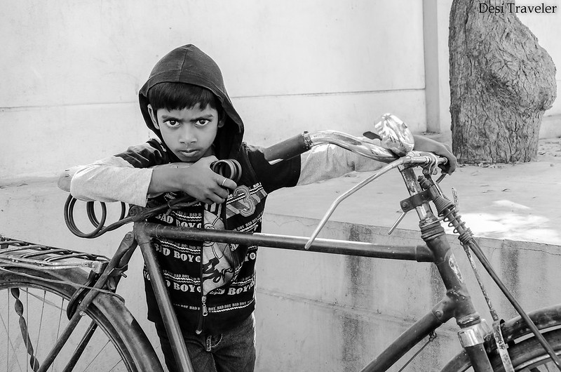 portrait of a boy with his cycle