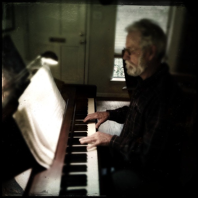 George playing the piano