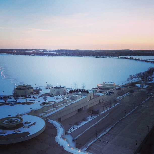 A view of the frozen snow covered lake in Madison,WI. We love it here!! You can't see them but there are ice fishers on the other side.