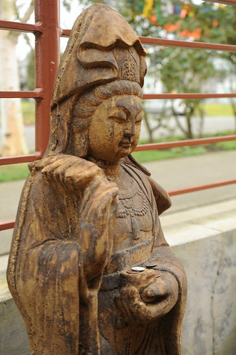 Quan Yin or Lady Tara, the bodhisattva of compassion, offerings in her hands, statue, Sakya Monastery of Tibetan Buddhism, Seattle, Washington, USA by Wonderlane