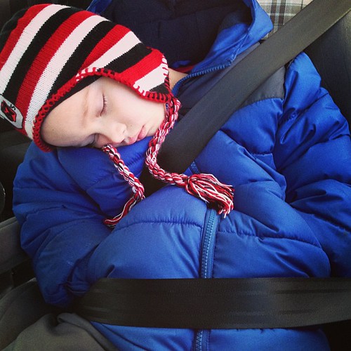 Winter car nap, with hands in pockets. Baby it's cold outside!