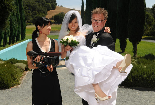 Filmmaker Lum and a white groom holding his Chinese wife