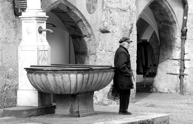 Old Woman By Fountain
