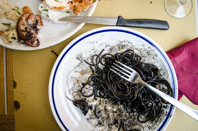Making a mess of my squid ink spaghetti in Venice.
